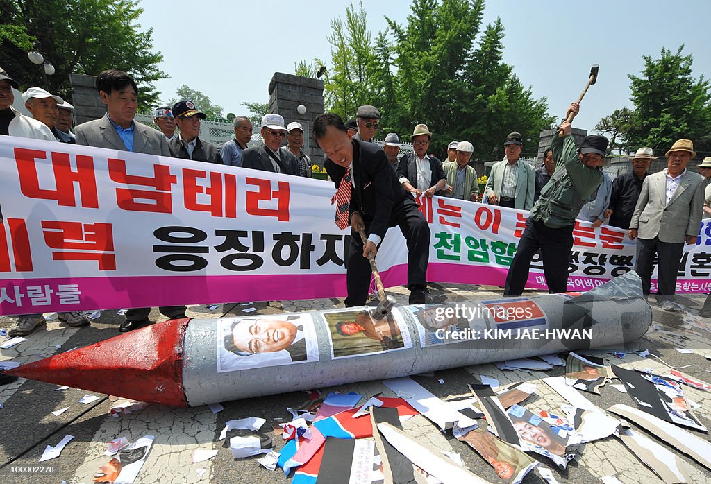 South Korean activists smash a mock Nort