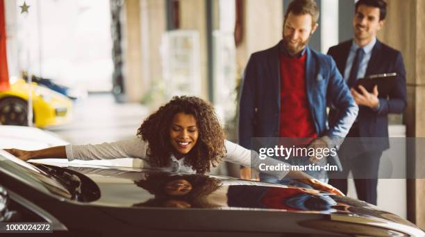 woman in love with new car - new husband stock pictures, royalty-free photos & images