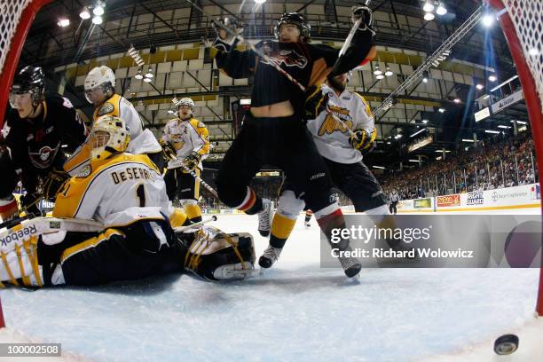 Tyler Shattock of the Calgary Hitmen scores a goal on Jacob De Serres of the Brandon Wheat Kings during the 2010 Mastercard Memorial Cup Tournament...