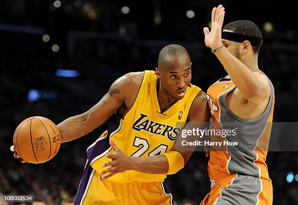 Kobe Bryant of the Los Angeles Lakers drives with the ball against Jared Dudley of the Phoenix Suns in the fourth quarter of Game Two of the Western...