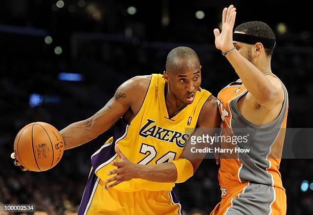 Kobe Bryant of the Los Angeles Lakers drives with the ball against Jared Dudley of the Phoenix Suns in the fourth quarter of Game Two of the Western...