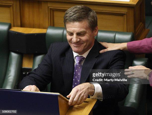 New Zealand's Finance Minister Bill English is congratulated after the reading the Budget in Parliament House on May 20, 2010 in Wellington, New...