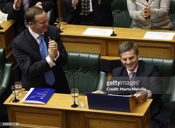 New Zealand's Finance Minister Bill English is congratulated by the Prime Minister of New Zealand John Key after the reading the Budget in Parliament...