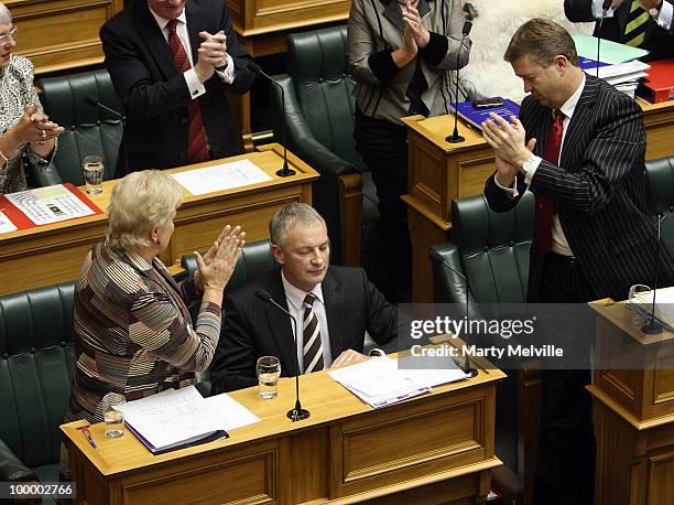 Leader of the Opposition Phil Goff is congratulated by Deputy leader Annette King and MP David Cunliffe after responding to the reading of the Budget...