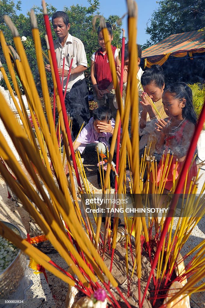 Cambodians pray during the annual 'Day o