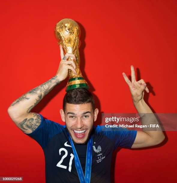 Lucas Hernández of France poses with the Champions World Cup trophy after the 2018 FIFA World Cup Russia Final between France and Croatia at Luzhniki...