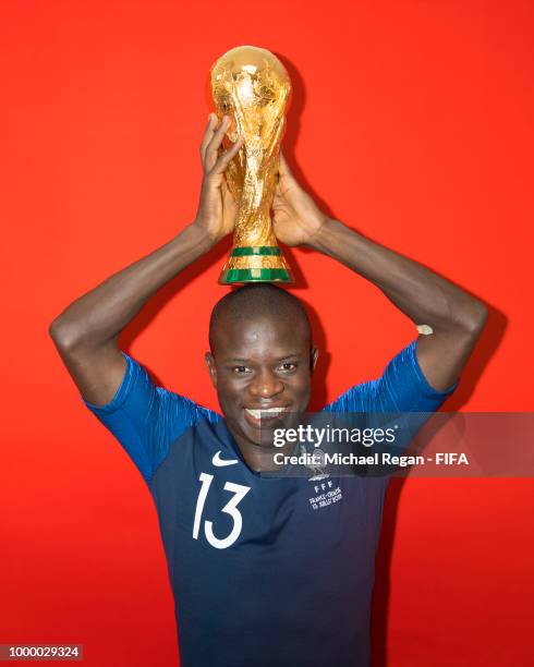Golo Kante of France poses with the Champions World Cup trophy after the 2018 FIFA World Cup Russia Final between France and Croatia at Luzhniki...