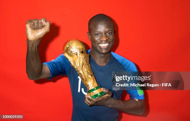 Golo Kante of France poses with the Champions World Cup trophy after the 2018 FIFA World Cup Russia Final between France and Croatia at Luzhniki...