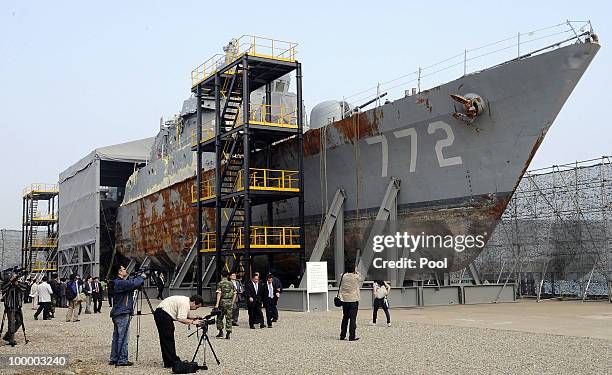 South Korean Navy rear admiral Park Jung-Soo talks in front of the wreckage of the naval vessel Cheonan, which was sunk on March 26 near the maritime...