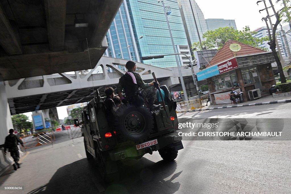 Thai soldiers patrol the deserted street