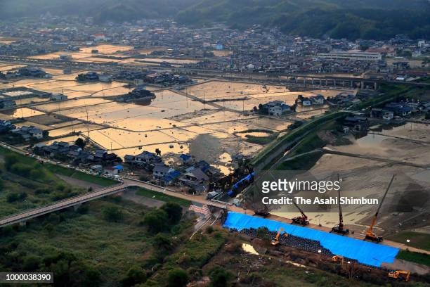 In this aerial image, floodwaters remain at Mabicho area a week after the flooding on July 14, 2018 in Kurashiki, Okayama, Japan. More than 100...