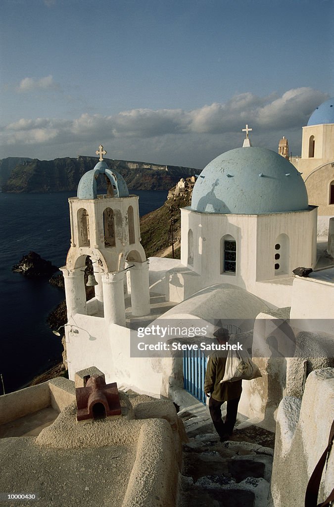 CHURCH STEEPLES BY SEA IN SANTORINI, GREECE