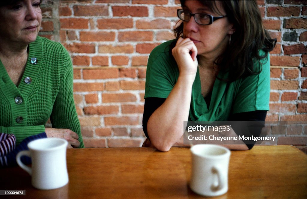 Mother and daughter drink coffee in the afternoon