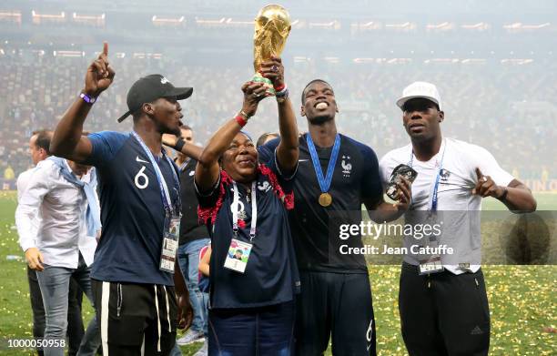 Paul Pogba of France celebrates the victory with his mother Yeo Pogba and his brothers Florentin Pogba, Mathias Pogba following the 2018 FIFA World...