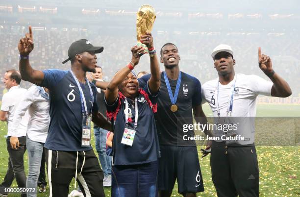 Paul Pogba of France celebrates the victory with his mother Yeo Pogba and his brothers Florentin Pogba, Mathias Pogba following the 2018 FIFA World...