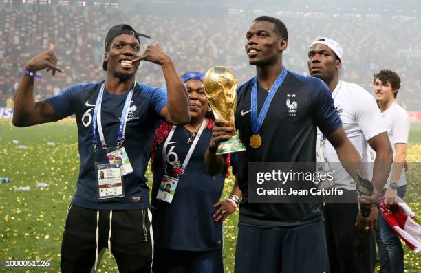 Paul Pogba of France celebrates the victory with his mother Yeo Pogba and his brothers Florentin Pogba, Mathias Pogba following the 2018 FIFA World...