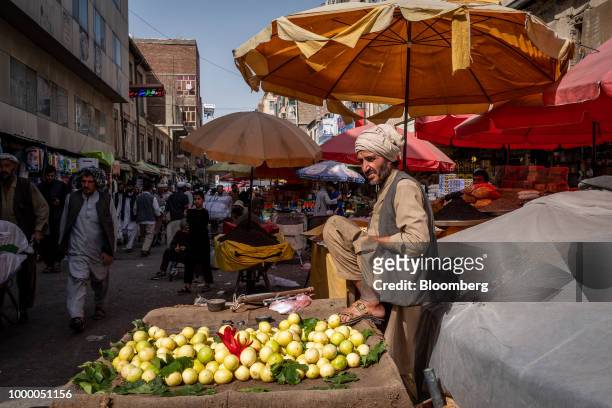 Fruit vendor waits for customers at Mandai Bazaar in Central Kabul, Afghanistan, on Thursday, July 12, 2018. U.S President Donald last year said...