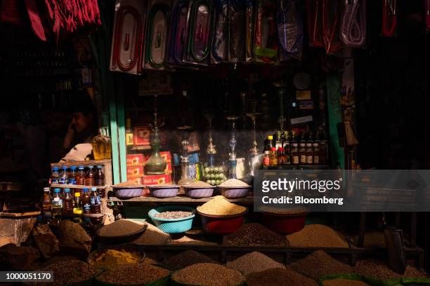 Dried fruits, nuts and spices are displayed alongside shisha pipes outside a store at Mandai Bazaar in Central Kabul, Afghanistan, on Thursday, July...