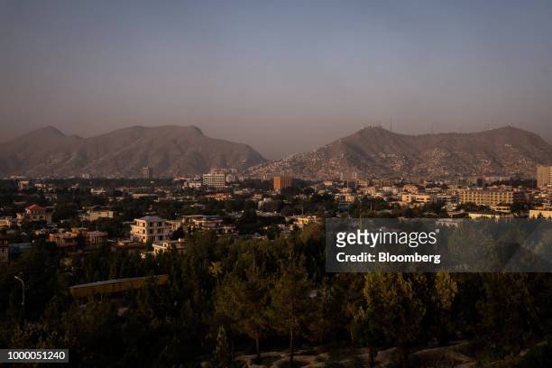 Commercial and residential buildings stand in Kabul, Afghanistan, on Sunday, July 15, 2018. U.S President Donald last year said 16,000 U.S. Troops...