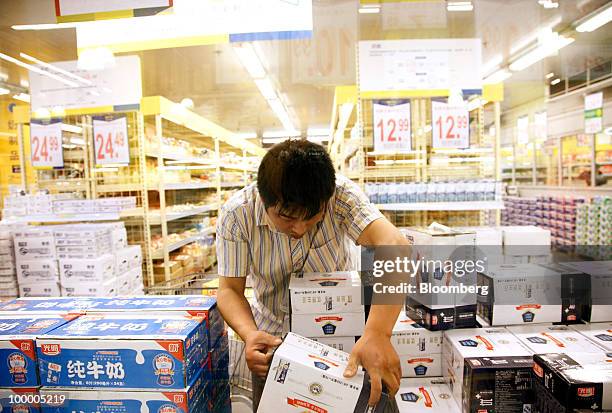 Customer shops at a Metro AG supermarket in Shanghai, China, on Wednesday, May 19, 2010. Metro AG, Germany's largest retailer, plans to add 100...