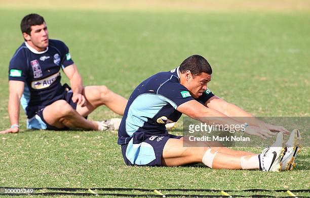 Timana Tahu stretches before a New South Wales Origin training session at WIN Stadium on May 20, 2010 in Wollongong, Australia.