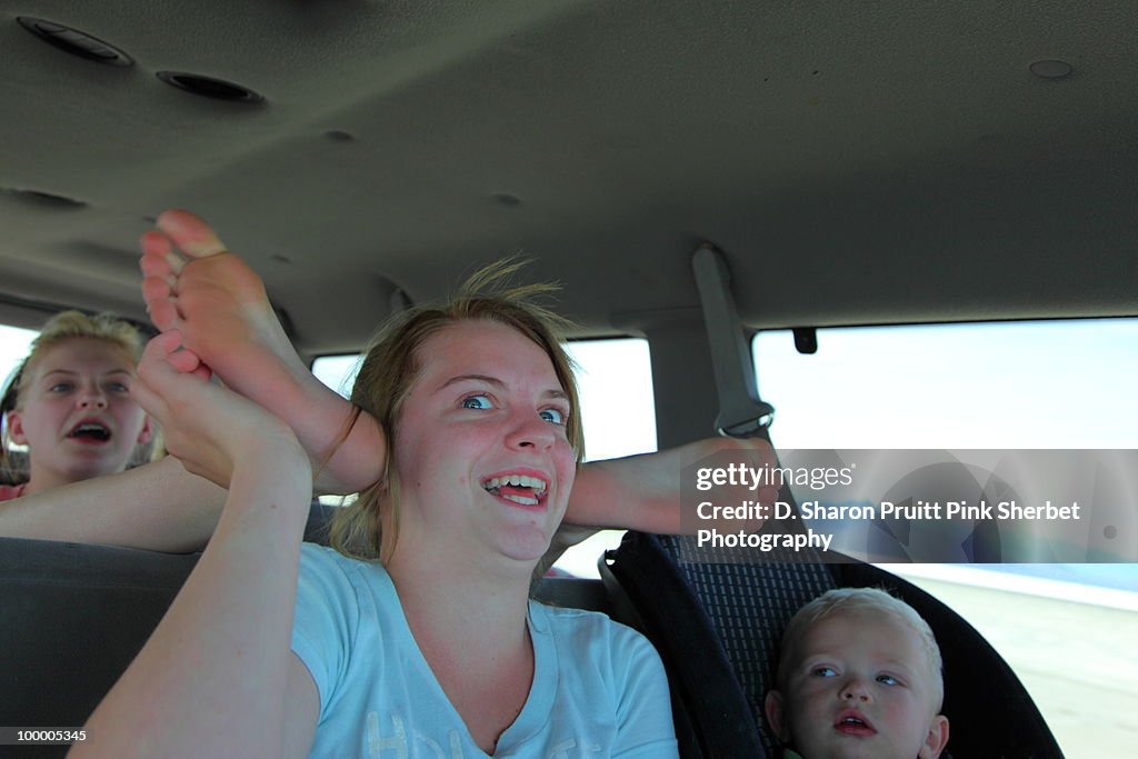 Kids In Family Car With Funny Roadtrip Psychosis