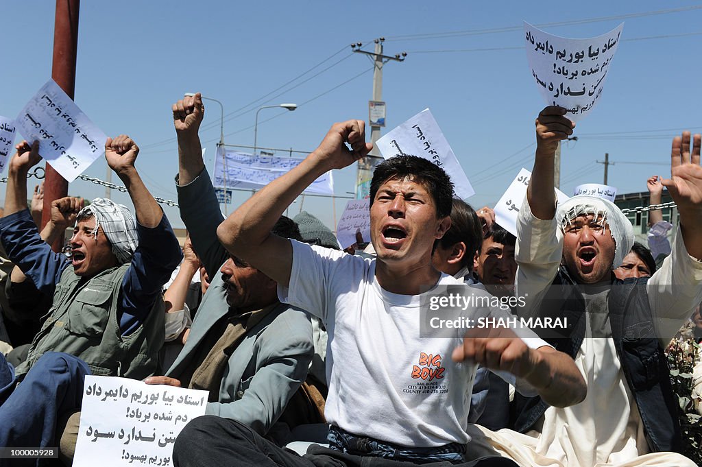 Afghan protestors shout slogans during a