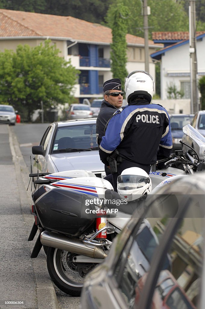 French policemen stand guard on May 20,