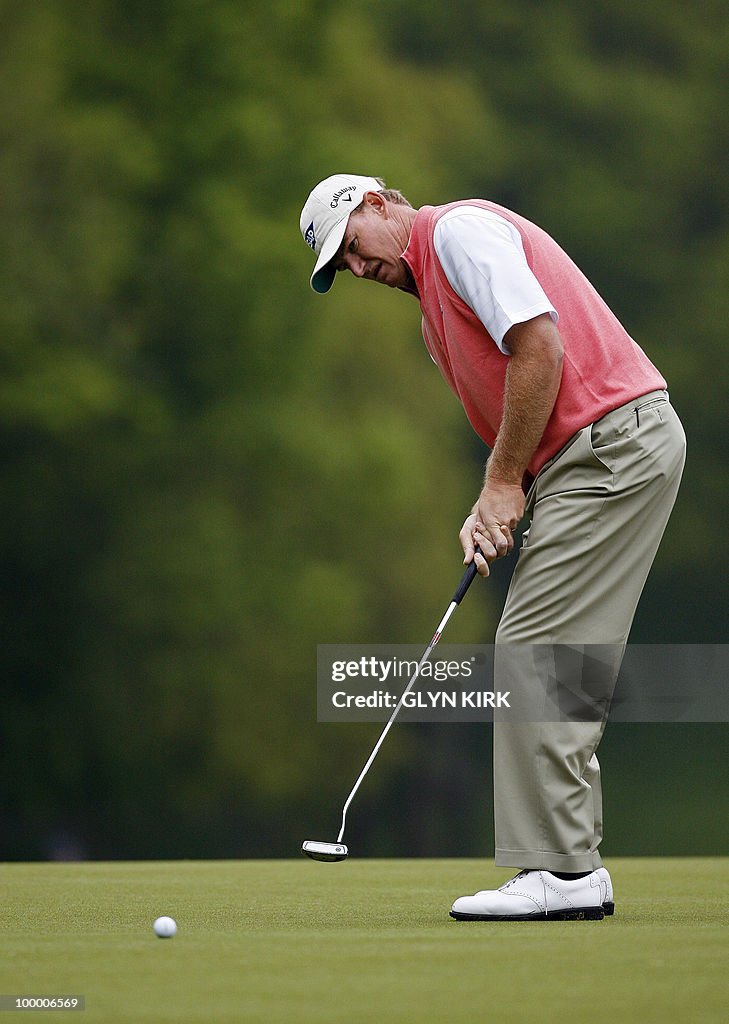 South African golfer Ernie Els putts on