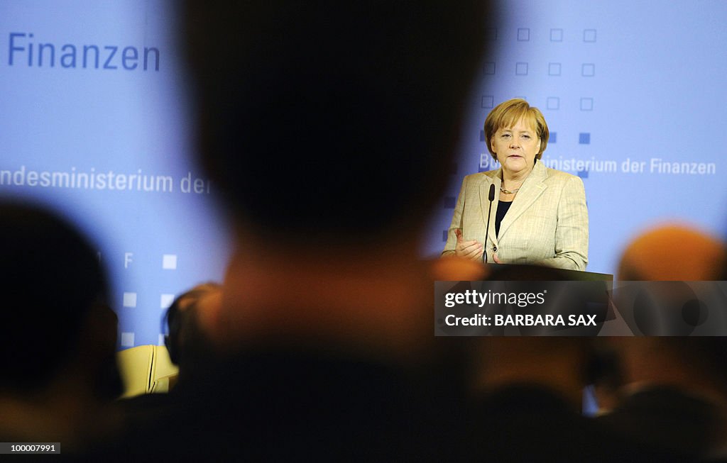 German Chancellor Angela Merkel gives a