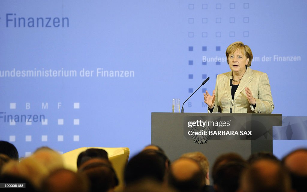 German Chancellor Angela Merkel gives a