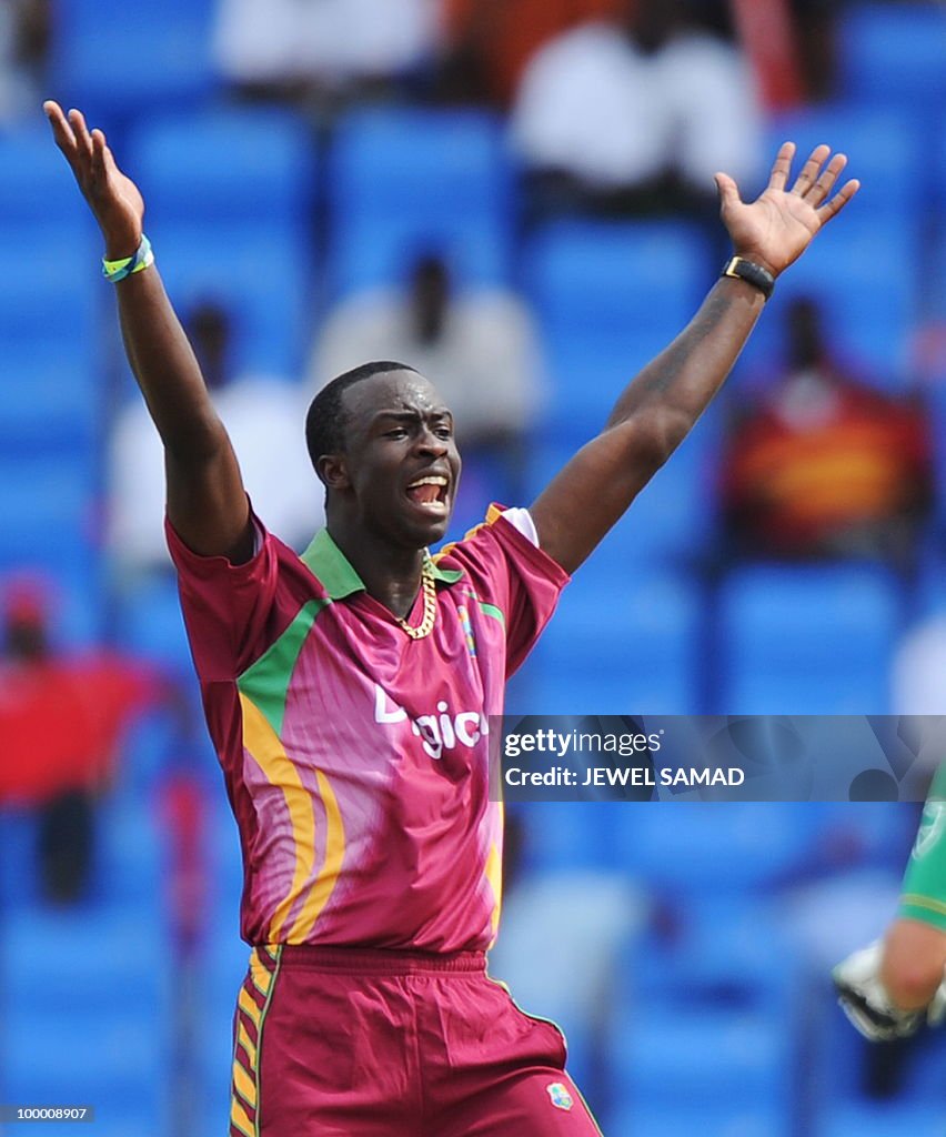 West Indies crickter Kemar Roach celebra