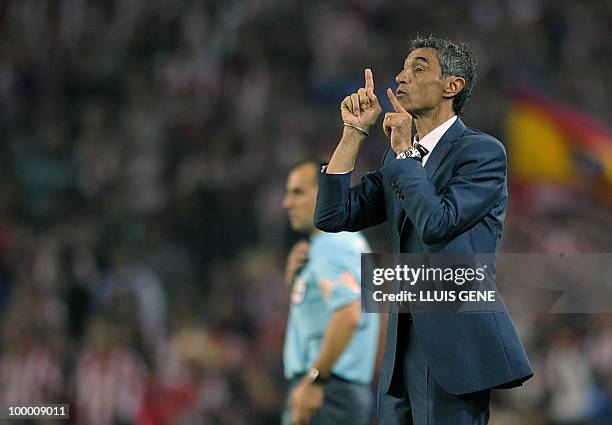 Sevilla´s coach Antonio Alvarez Giraldez gives instructions to his players during the King�s Cup final match Sevilla against Atletico Madrid at the...