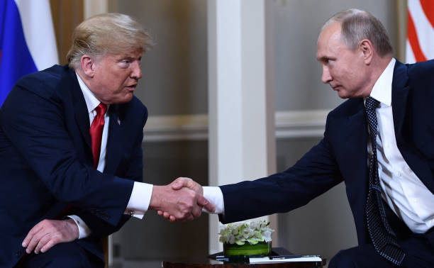 russian-president-vladimir-putin-and-us-president-donald-trump-shake-hands-before-a-meeting.jpg