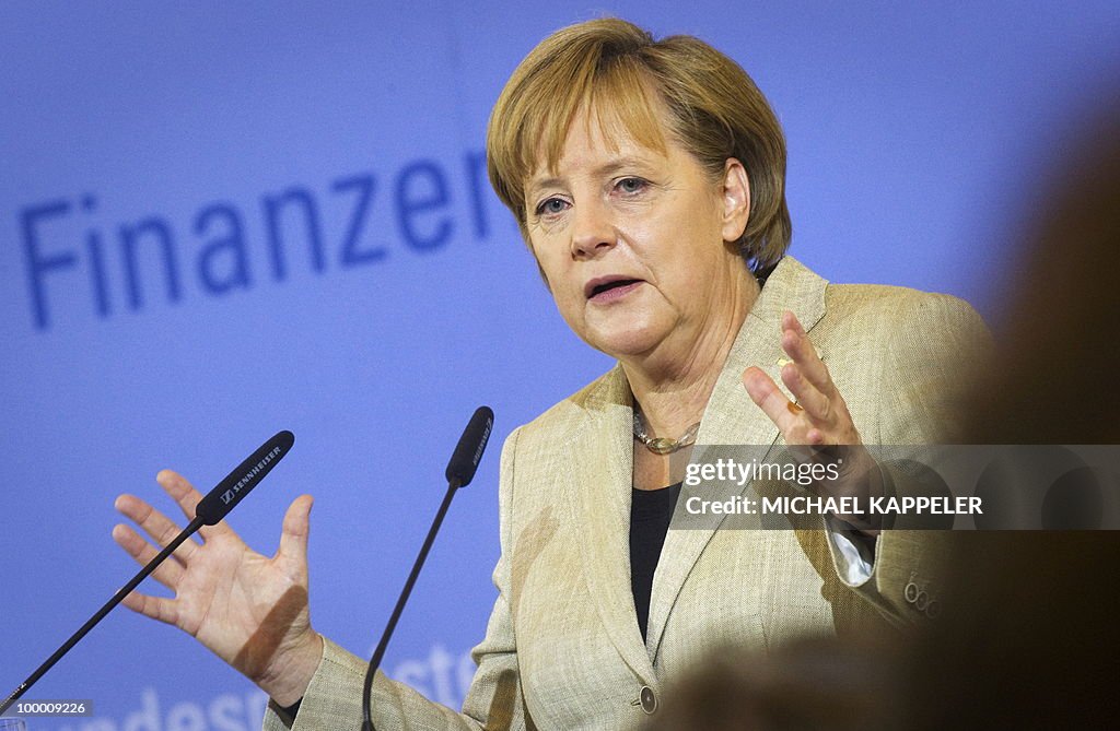 German Chancellor Angela Merkel gives a