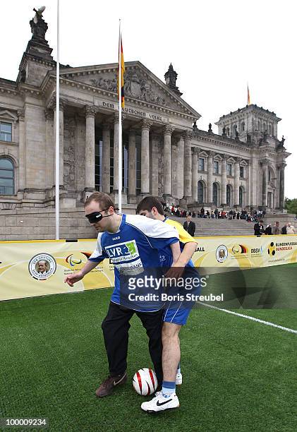 Two football players warm up prior to the Blind Football National match between Germany and Turkey on the �Day of Blind Football� in front of the...