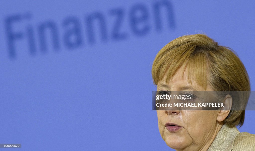 German Chancellor Angela Merkel gives a