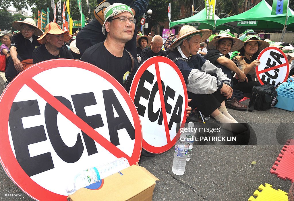 "Anti-ECFA" signs are displayed during a