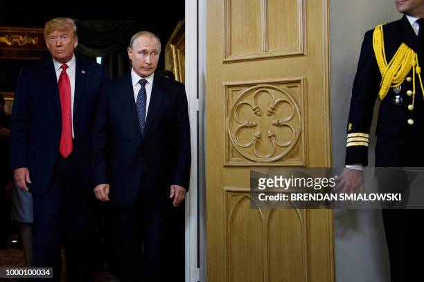 President Donald Trump and Russian President Vladimir Putin arrive for a meeting in Helsinki, on July 16, 2018.