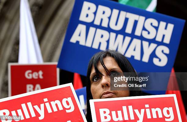 Member of British Airways cabin crew awaits Unite's High Court appeal on a ban on strike action by BA cabin crew outside the High Court on May 20,...