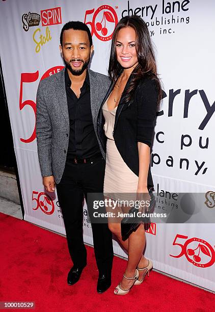 Singer John Legend and model Christine Teigen pose on the red carpet at the Cherry Lane Music Publishing's 50th Anniversary celebration at Brooklyn...