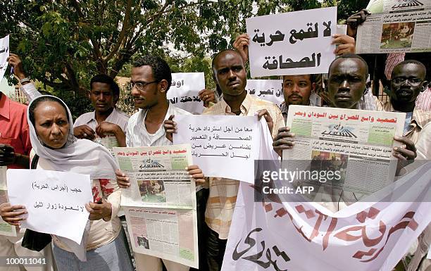 Sudanese protest against the storming by security forces of the offices of two newspapers in the capital Khartoum on May 20, 2010. Sudanese security...