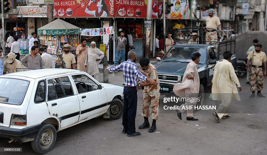 A Pakistani paramilitary soldier (C) sea