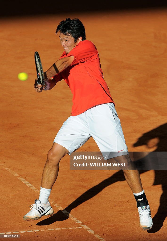 Tatsuma Ito of Japan hits a backhand ret