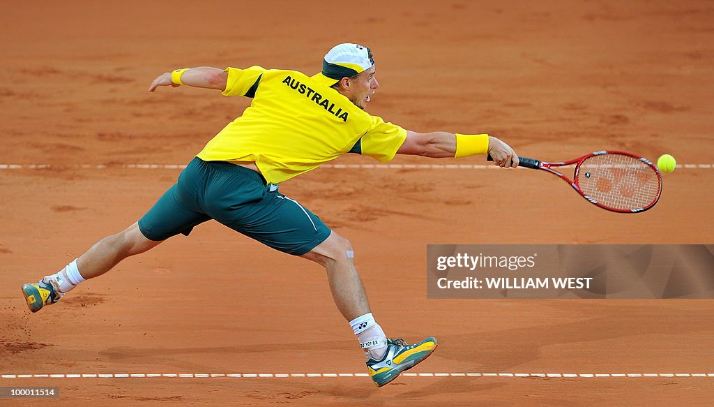 Lleyton Hewitt of Australia lunges for t