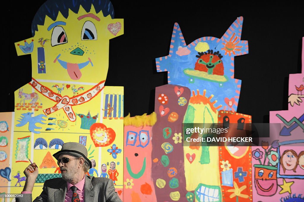 US pop-artist James Rizzi sits in front