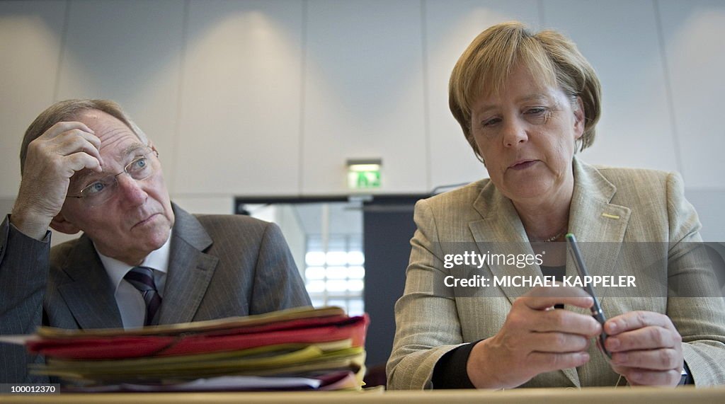 German Chancellor Angela Merkel talks wi