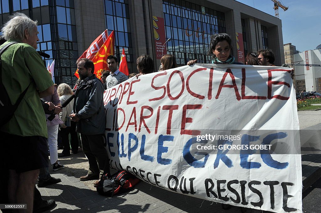 People hold a banner asking for a "Socia