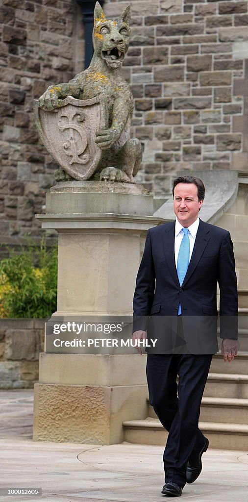 British Prime Minister David Cameron lea