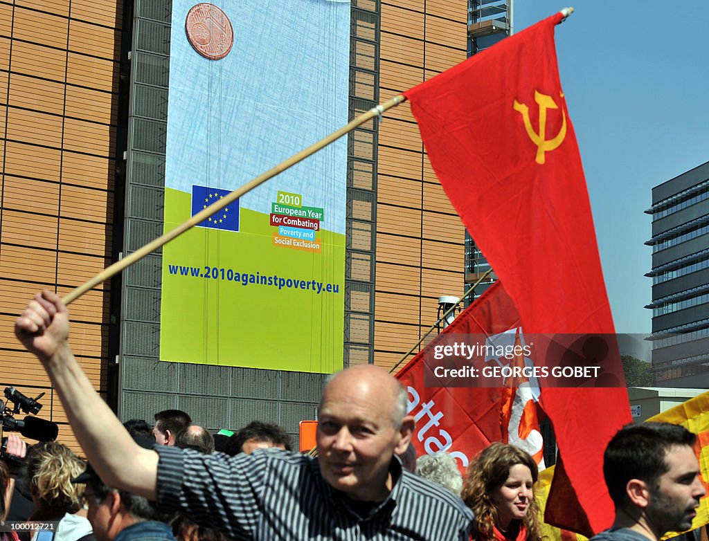 A man waves the communist red flag durin